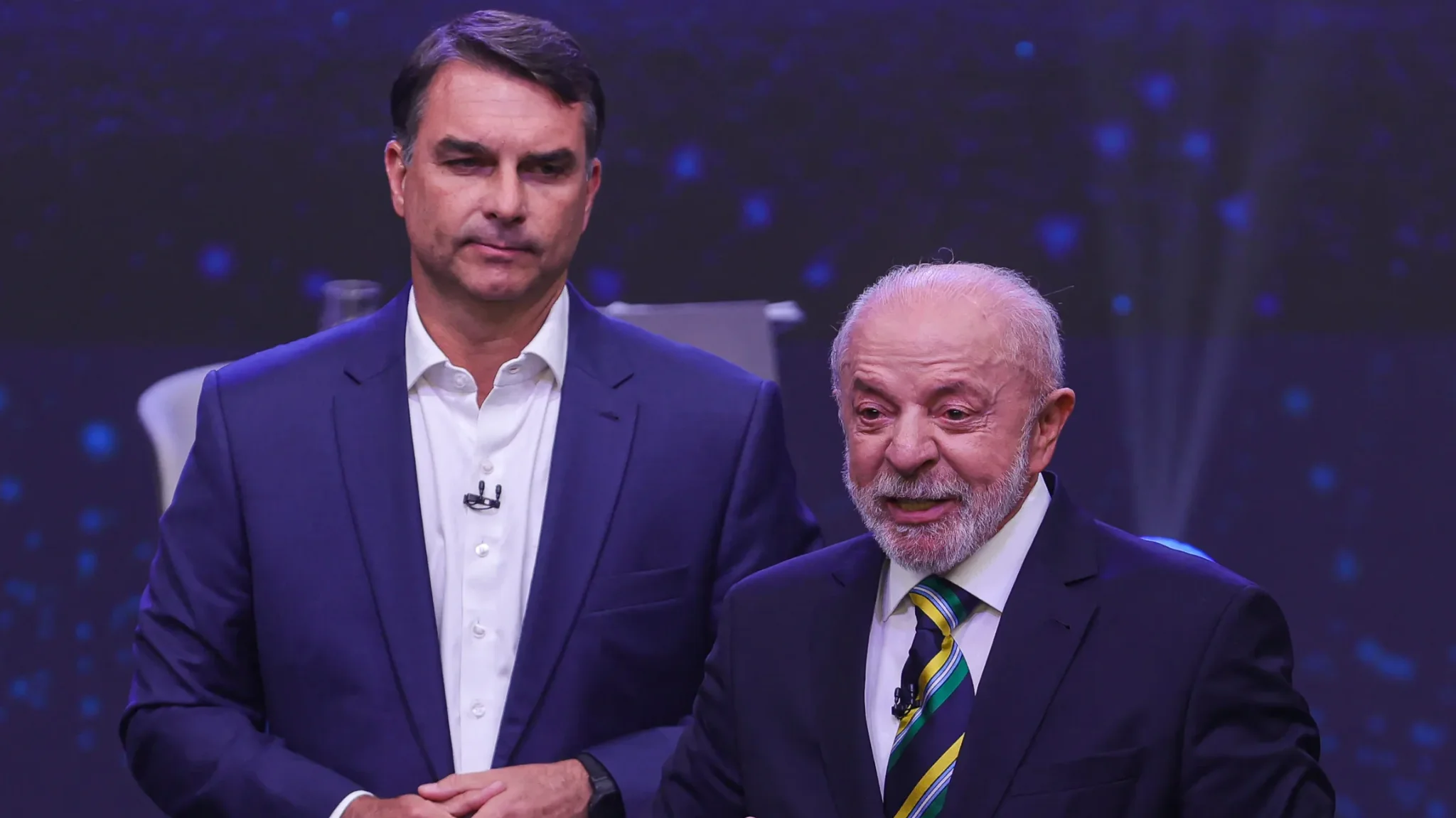 Flávio Bolsonaro e Lula no debate da Band