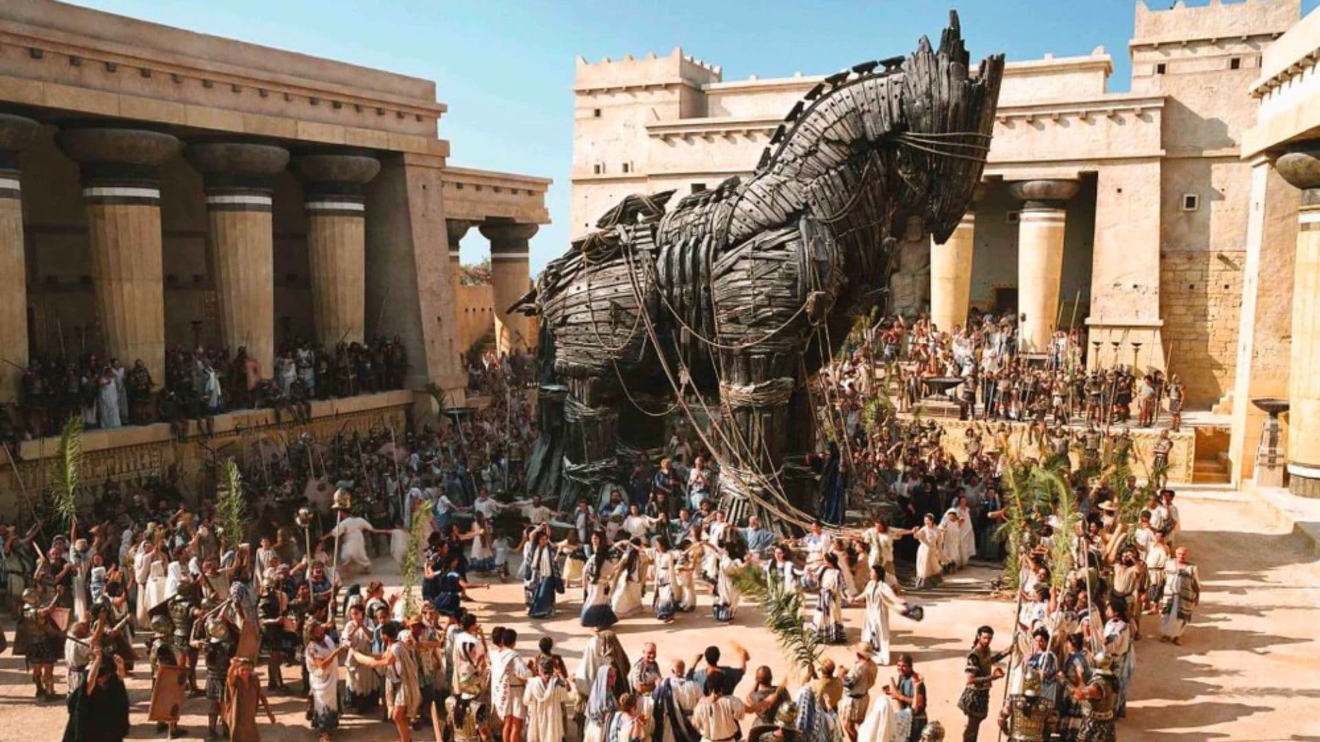 Cavalo de Troia entrando na cidade e sendo celebrado.